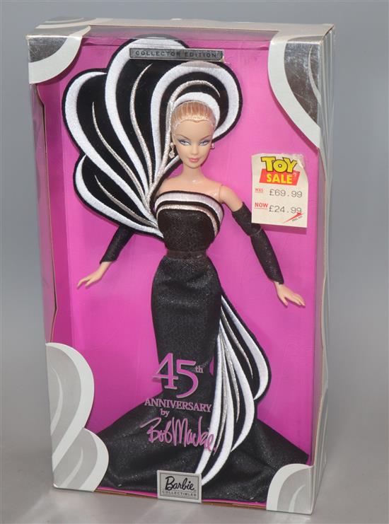 Five Bob Mackie Barbie dolls: Holiday Barbie (2), Mackie Brunette Brilliance, 45th Anniversary and The Sterling Silver